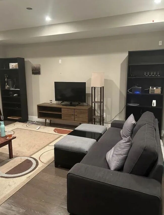 Photo - “Elegant 3-Story Home Showcasing High-End Renovation, Gourmet Kitchen, and Private Deck for Moder...