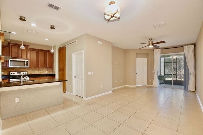 Photo - Gorgeous 4/2.5 Spacious Townhome with a Loft Area and a 2 Car Garage in the Desirable Gated Commu...