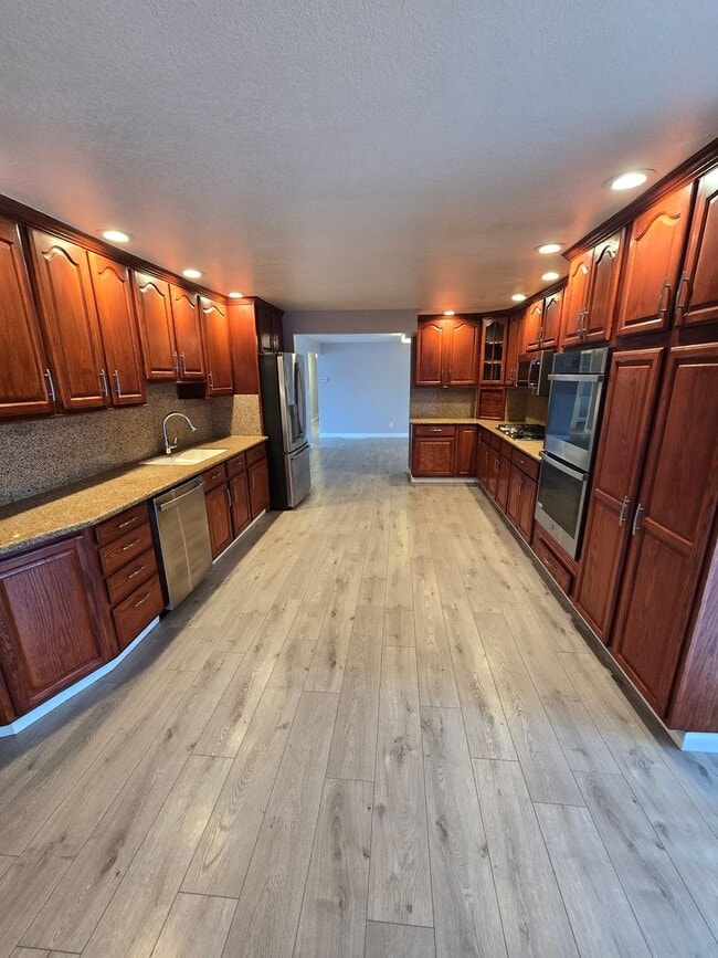 Photo - HUGE Bonus room ! Remodeled !  Hardwood Flooring Throughout & New Carpet in Bedrooms, Tile, Grani... House