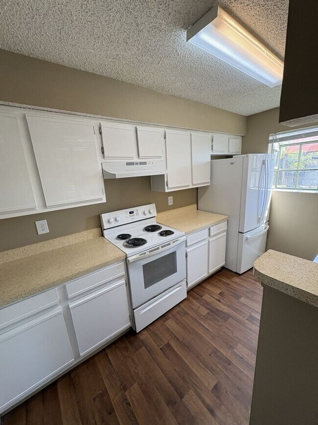 Building Photo - WRAP AROUND PATIO  - LARGE TWO BEDROOM READY NOW!!  $1400 MONTHLY RENT includes water