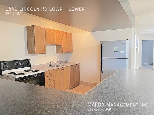 Photo du bâtiment - COZY OPEN CONCEPT 2 BED/1 BATH LOWER UNIT ...