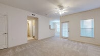 This single-floor, 3-bedroom, 2-bathroom home in Shreveport, Louisiana offers a well-organized layout designed for comfortable everyday living. The living room is a welcoming, open space featuring neutral carpet, a ceiling fan with integrated lighting, and a door that brings in natural light. It connects seamlessly to the dining room, which is illuminated by a hanging pendant light and benefits from a bright window with blinds, and to the kitchen via a pass-through counter. The galley-style kitchen is efficiently designed with light wood cabinetry, laminate countertops, hardwood-style flooring, and white appliances including a range, refrigerator, dishwasher, and microwave. The primary bedroom is generously sized with plush carpeting, a ceiling fan, and access to a spacious walk-in closet outfitted with wire shelving and hanging rods. The additional bedrooms are well-proportioned, each with carpet and ceiling fans. The bathrooms feature hardwood-style flooring and light wood vanities. A dedicated hallway and closet round out the thoughtfully arranged floor plan, making this home a practical and inviting space throughout.