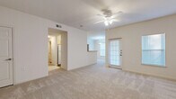 This single-floor, 3-bedroom, 2-bathroom home in Shreveport, Louisiana offers a well-organized layout designed for comfortable everyday living. The living room is a welcoming, open space featuring neutral carpet, a ceiling fan with integrated lighting, and a door that brings in natural light. It connects seamlessly to the dining room, which is illuminated by a hanging pendant light and benefits from a bright window with blinds, and to the kitchen via a pass-through counter. The galley-style kitchen is efficiently designed with light wood cabinetry, laminate countertops, hardwood-style flooring, and white appliances including a range, refrigerator, dishwasher, and microwave. The primary bedroom is generously sized with plush carpeting, a ceiling fan, and access to a spacious walk-in closet outfitted with wire shelving and hanging rods. The additional bedrooms are well-proportioned, each with carpet and ceiling fans. The bathrooms feature hardwood-style flooring and light wood vanities. A dedicated hallway and closet round out the thoughtfully arranged floor plan, making this home a practical and inviting space throughout.