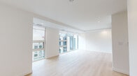 Located at 1470 Queen St in Halifax, Nova Scotia, this modern 2-bedroom, 2-bathroom residence offers a clean, contemporary design with a bright and airy atmosphere. Light-toned hardwood flooring runs throughout the main living areas, complementing the crisp white walls and recessed lighting that give the space a polished, minimalist feel.

The spacious living room is a standout feature, boasting expansive floor-to-ceiling windows that flood the room with natural light and frame views of the surrounding Halifax cityscape. The open layout provides a versatile and welcoming environment.

Both bedrooms are well-proportioned, with the primary bedroom offering generous closet space. Light hardwood floors continue through the bedrooms, maintaining a cohesive aesthetic. A dedicated closet provides additional storage.

The two bathrooms are finished in neutral tones with modern fixtures. The first bathroom features a soaking tub with a shower combination and a sleek undermount sink vanity with a large mirror. The second bathroom offers a glass-enclosed walk-in shower, a matching undermount vanity, and light tile flooring.

A connecting hallway leads efficiently between rooms, and an in-unit washer and dryer is also included. The overall ambiance is contemporary and light-filled, ideal for urban living in the heart of Halifax.