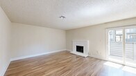 Located at 200 Bicentennial Circle in Sacramento, CA, this single-floor residence offers three bedrooms, two bathrooms, and a well-organized layout designed for comfortable living. Light-toned hardwood-style flooring runs throughout, creating a cohesive and clean aesthetic across all rooms.

The open living room is a standout feature, highlighted by a white brick fireplace and a textured ceiling, providing a warm and inviting atmosphere. The kitchen is efficiently arranged with warm wood cabinetry, light countertops, and stainless steel appliances including a refrigerator, electric range, and dishwasher. A window above the counter allows natural light to brighten the space.

The three bedrooms are generously proportioned, each featuring the same hardwood-style flooring, neutral walls, textured ceilings, and windows with blinds that bring in natural light. The primary bedroom offers a notably spacious footprint. Both bathrooms are finished with wood-toned vanity cabinetry, white countertops, and matching flooring. One bathroom includes a tub-shower combo, while the other features a shower with sliding glass doors.

A dedicated closet provides additional storage. The overall design is clean and neutral, offering a functional and move-in ready living environment.