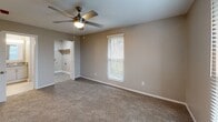 Located at 102 Brentway Cir in Knoxville, Tennessee, this single-story, 3-bedroom, 3-bathroom home offers a practical and comfortable layout across a well-organized floor plan. The combined dining and living area serves as the heart of the home, featuring light gray wood-look flooring and neutral warm-toned walls that create a clean, welcoming atmosphere throughout. The kitchen is complemented by a dedicated pantry, providing ample storage for everyday living, while a utility room adds further functional convenience.

Each of the three bedrooms is carpeted in a neutral tone and equipped with a ceiling fan with light fixture, offering comfort year-round. The bedrooms feature closets with louvered or sliding doors, and windows with blinds that bring in natural light. The primary bedroom is generously sized and includes access to a walk-in closet with built-in shelving and an en-suite bathroom featuring a glass-enclosed shower and wood-look tile flooring. The additional bathrooms are well-appointed, with one offering a tiled tub/shower combination accented by wood-toned tile trim. A hallway connects the bedrooms and bathrooms, keeping the layout efficient. With four closets spread throughout the home, storage is plentiful in this move-in ready Knoxville residence.