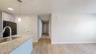 Located at 745 N 78th St in Kansas City, KS, this single-story, 2-bedroom, 1-bathroom home offers a clean, modern aesthetic throughout. Light wood-style flooring flows consistently across the entire floor plan, complementing the crisp white walls and creating a bright, cohesive atmosphere.

The kitchen is a standout feature, showcasing gray shaker-style cabinetry, granite countertops, and a large peninsula with an undermount sink — ideal for both meal preparation and casual dining. Pendant lighting above the peninsula adds a refined touch, while black and stainless steel appliances complete the functional layout.

Both bedrooms are well-proportioned and share consistent finishes, each equipped with ceiling fans with light fixtures and windows that bring in natural light. The primary bedroom is generously sized and provides access to a dedicated closet fitted with wire shelving for organized storage.

The bathroom features gray cabinetry with gold hardware, a granite vanity countertop, a large mirror, and wood-style flooring that ties into the rest of the home. Grab bars are also present, adding an element of accessibility.

The overall design emphasizes practicality and modern style, with neutral tones, clean lines, and quality finishes throughout — making this a move-in ready home.