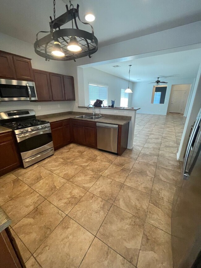 Building Photo - COMING SOON! Fireside at Norterra Spacious...
