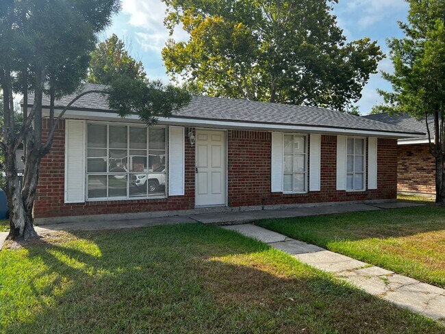 Building Photo - 3 Bedroom, 1.5 Bathroom, Brick Home with yard and Storage Building, Covered Porch