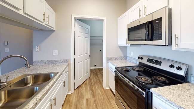 Modern Kitchen with Stainless Steel Appliances - Montclair Parc Apartments