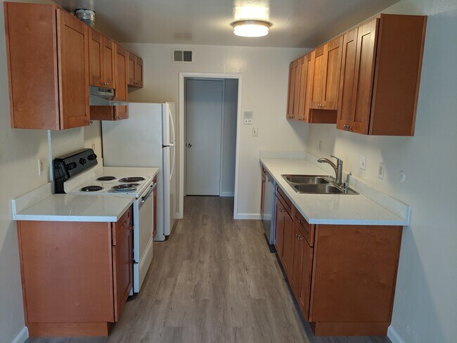 Kitchen with brand new cabinets and quartz countertops - 38631 Hastings St