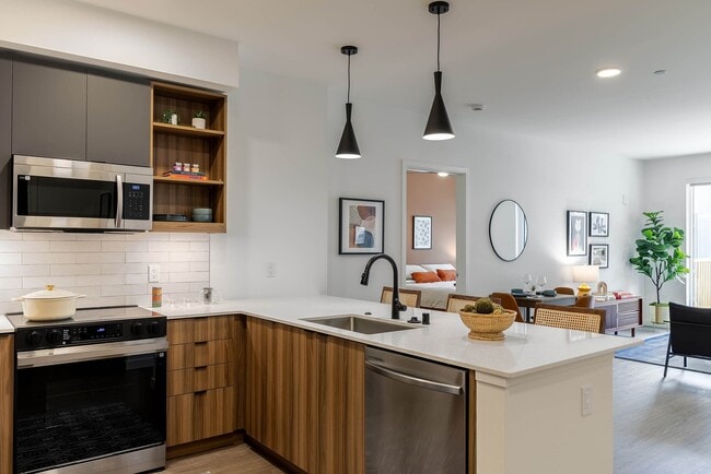 Apartment kitchen and living area with cool finish package - AMLI Redmond Way