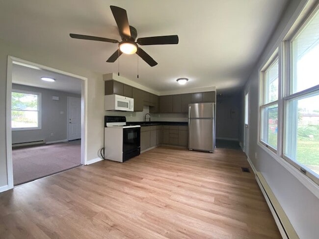Building Photo - Welcome to this charming three bedroom, on...