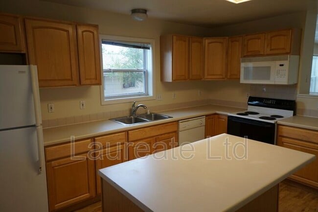 Building Photo - 6062 E 62nd Ave