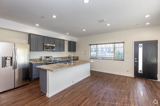Cocina y sala de estar - MBAY GATEWAY SUITES