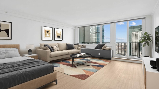 Living Room with Hard Surface Flooring - The Towers at Longfellow Apartments