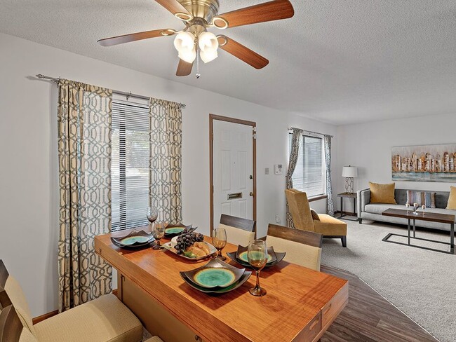 Dining Area with Overhead Light - Villa West Apartments and Townhomes