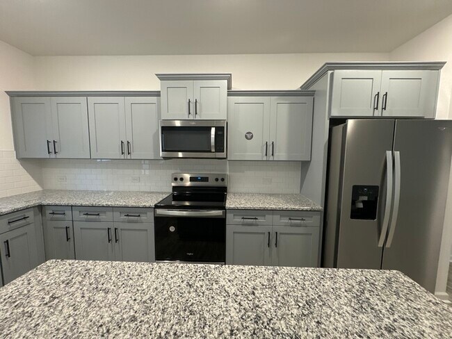 Building Photo - Three bedroom 2 1/2 bathroom townhome with...