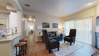 Located at 2727 Nelson Rd in Longmont, Colorado, this thoughtfully designed 2-bedroom, 1-bathroom residence offers a comfortable and functional single-floor layout. Wood-style flooring flows throughout the main living areas, lending warmth and continuity to the space.

The living room is bright and inviting, anchored by large sliding glass doors with vertical blinds that open to a private balcony and allow generous natural light to fill the room. Adjacent to the living room, the dedicated dining area features pendant lighting and offers a well-defined space for meals.

The kitchen is equipped with stainless steel appliances, white cabinetry, granite-style countertops, a central island with bar seating, and track lighting overhead — making it both practical and visually appealing. A dedicated in-unit laundry area with a full-size washer and dryer adds everyday convenience.

The primary bedroom is a comfortable retreat with carpet flooring and natural light from well-positioned windows. The second bedroom offers flexibility, functioning equally well as a guest room or home office. The full bathroom features a wide double vanity with ample counter space, white cabinetry, and a shower-tub combination. Three closets throughout the unit provide generous storage.