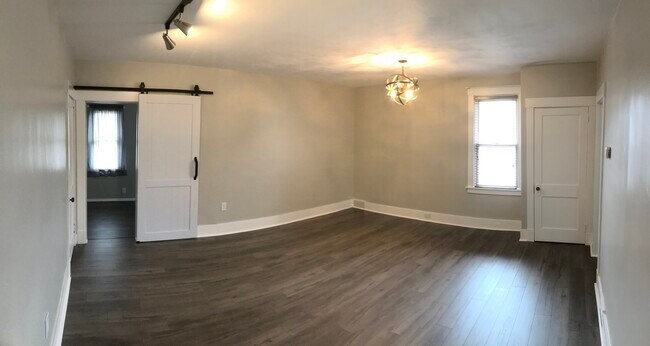 Living room w/ barn door into bedroom/office - 10 Cornell Ave