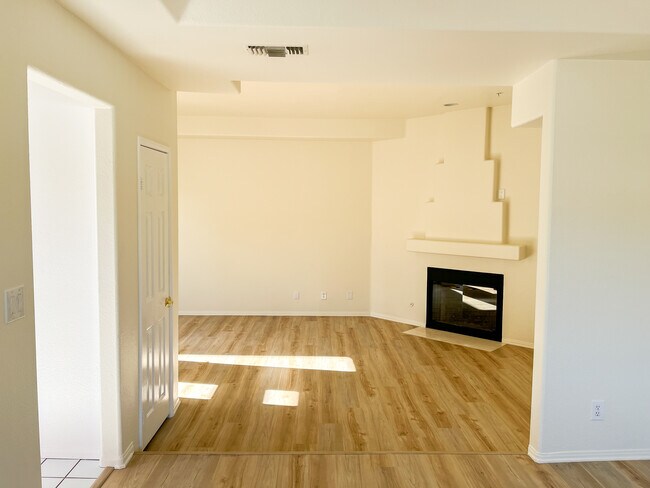 Large, sunny living room with fireplace - 10626 Valley Spring Ln