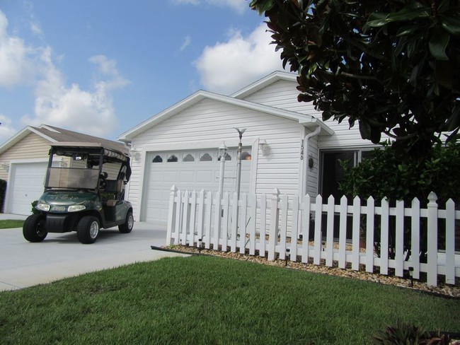 Building Photo - Updated Patio Villa with a Golf Cart