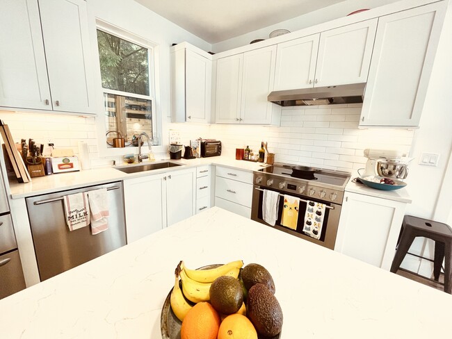 Kitchen w/induction stovetop - 4127 40th Ave SW