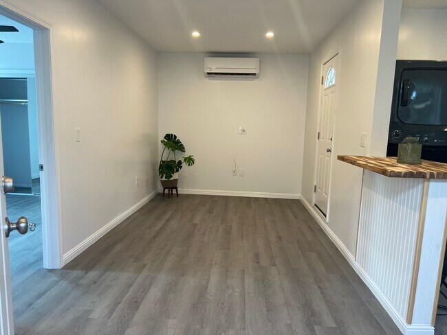 Brand new vinyl flooring throughout home. Living room houses the heater and AC - 9300 Benson Way