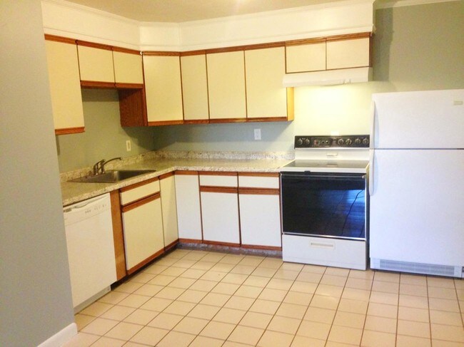 More counter/cabinets, stove & refrigerator. - 176 Maple Ave