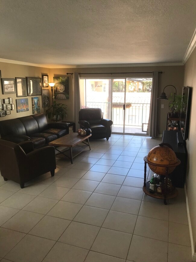 Living room, fresh paint and new baseboards throughout - 1335 Newport Ave