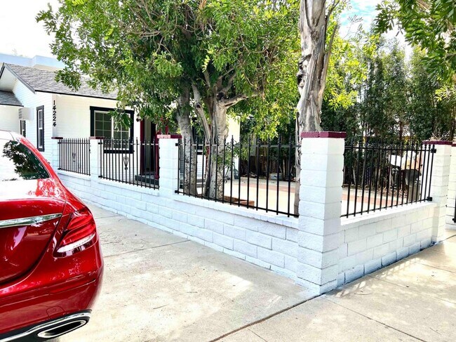 side of front yard - 14224 Friar St