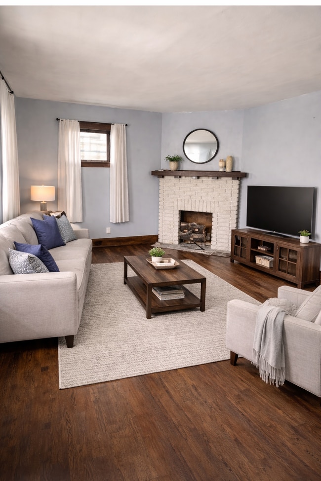Living room w fake fireplace - 2041 Elbur Ave