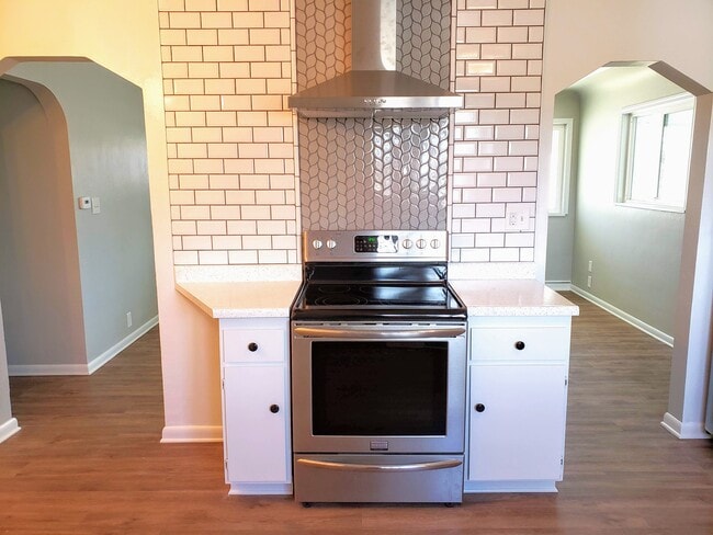 Updated kitchen with SS appliances and gorgeous tile back-splash. - 3155 S Fox St