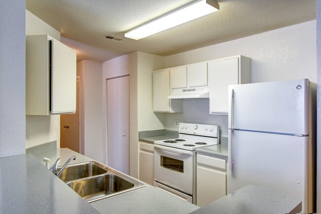 Fully-equipped kitchen with breakfast bar and pantry - Hallmark at Timberlake Apartments