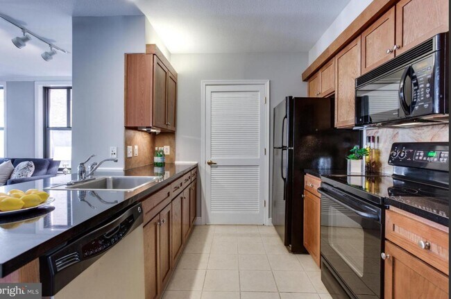Kitchen. New washer and Dryer behind the door. - 616 E St NW