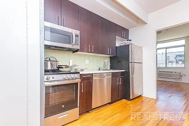 Building Photo - Massive Outdoor Patio | Spacious 3BR/2BA Apartment in Bushwick–East Williamsburg