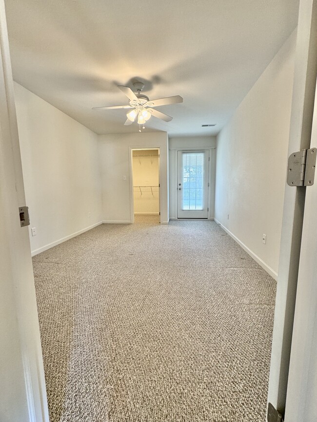 1st floor bedroom, large walk in closet, door to outside - 21 Wheatstone Ln