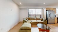 Located at 1167 W 37th Pl in Los Angeles, this modern single-floor residence offers 3 bedrooms and 2 bathrooms with a clean, contemporary design throughout. Light wood-tone flooring runs seamlessly across the entire home, creating a cohesive and airy aesthetic. The open living area is anchored by a large window that welcomes natural light, while recessed lighting provides consistent illumination throughout. The kitchen is well-appointed with light maple shaker-style cabinetry, quartz countertops, a marble-look tile backsplash, a stainless steel gas range, and a stainless steel sink — combining both style and functionality. A dining area adjacent to the kitchen provides space for shared meals. Each of the three bedrooms is generously proportioned, featuring crisp white walls, recessed lighting, and ample closet space — including walk-in closets in select rooms. The primary bedroom is notably spacious. The two bathrooms maintain the home's modern character, showcasing floating vanities, vessel sinks, matte black fixtures, backlit mirrors, and wood-look tile flooring. A hallway connects the private and shared spaces efficiently. The overall ambiance is bright, minimalist, and move-in ready.
