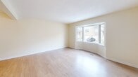 Located at 490 Veterans Dr in Barrie, Ontario, this well-organized multi-floor home offers three bedrooms, two bathrooms, and a thoughtful layout spread across three levels. The entry level sets a welcoming tone with a generously sized living room featuring light hardwood flooring and a large bay window that frames views of the surrounding neighbourhood, flooding the space with natural light. The main living level also includes an open-concept kitchen, dining, and living area. The kitchen is outfitted with white cabinetry, a peninsula countertop ideal for casual dining, tile flooring, and white appliances including a stove, refrigerator, and dishwasher. A staircase connects seamlessly to the upper levels. The upper floors house three bedrooms, including a spacious primary bedroom with soft carpet flooring, two doors leading to a closet and an additional room, and ample space throughout. The secondary bedrooms also feature light hardwood flooring and windows with neighbourhood views. The bathrooms are finished with tile flooring and surrounds, featuring a combined tub and shower. A dedicated laundry room with side-by-side washer and dryer adds everyday convenience. Throughout, warm neutral tones and clean white trim create a bright, functional living environment.