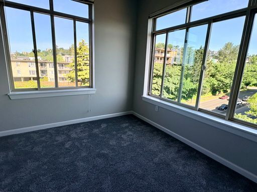 Building Photo - Top-Floor Corner 2BR with Lake Union Views + Garage Parking Included!