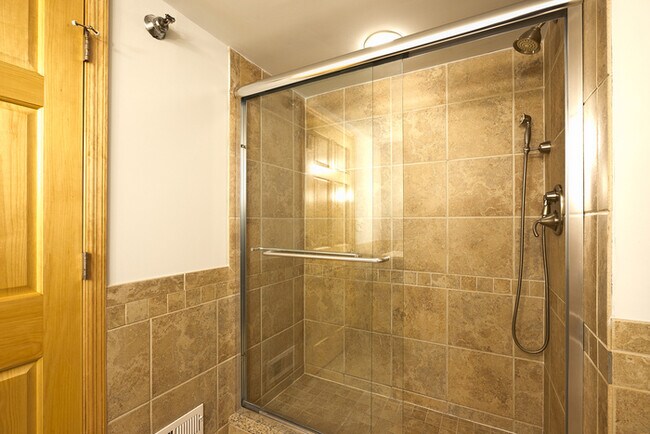 Building Photo - This two bedroom, two bathroom brick expos...