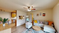 Located at 395 Ano Nuevo Ave in Sunnyvale, CA, this single-floor, 2-bedroom, 2-bathroom residence offers a thoughtfully designed layout with consistent light wood-style flooring and a neutral warm palette throughout. The living room is a comfortable, light-filled space anchored by a ceiling fan and large sliding glass doors that open to a private balcony with outdoor seating and greenery views. The galley-style kitchen is equipped with warm honey-toned wood cabinetry, white countertops, and stainless steel appliances including a refrigerator, electric range, and over-the-range microwave. It opens to a dedicated dining area with ample room for a full dining set. The spacious primary bedroom features a large window overlooking lush greenery, a baseboard heater, and generous natural light. The second bedroom includes a sizable sliding-door closet and its own window. Both bathrooms are finished with light wood flooring, warm-toned walls, and tub-shower combinations. The overall ambiance is clean, functional, and inviting, making it an excellent residence in the heart of Silicon Valley.