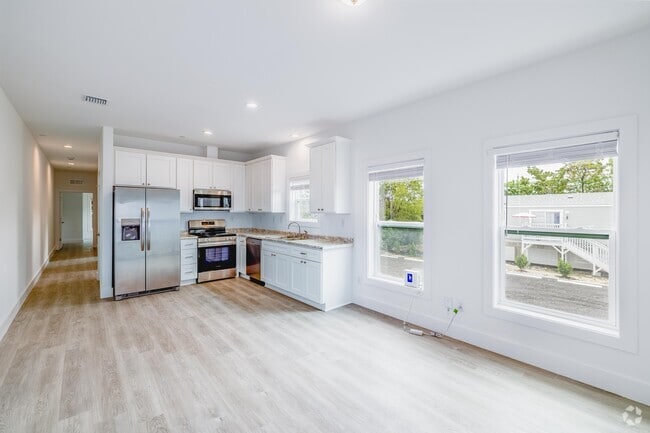 2BR, 2BA - 900SF - Living Room/Kitchen - Coco Palms