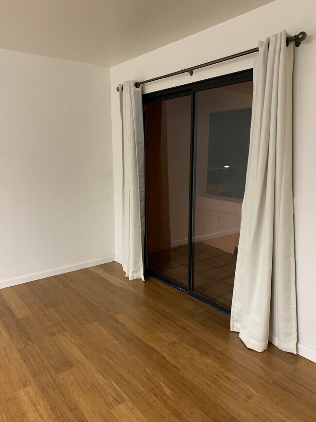 living room to patio - 4810 S La Brea Ave