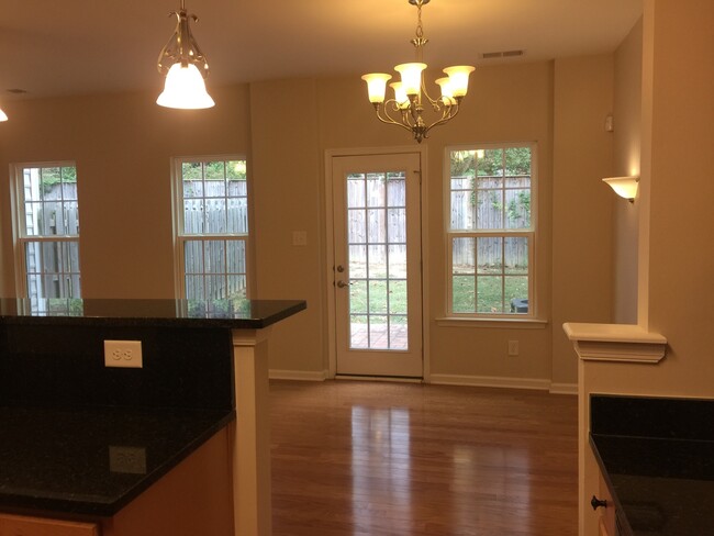 Building Photo - Move in ready townhome with garage and fen...