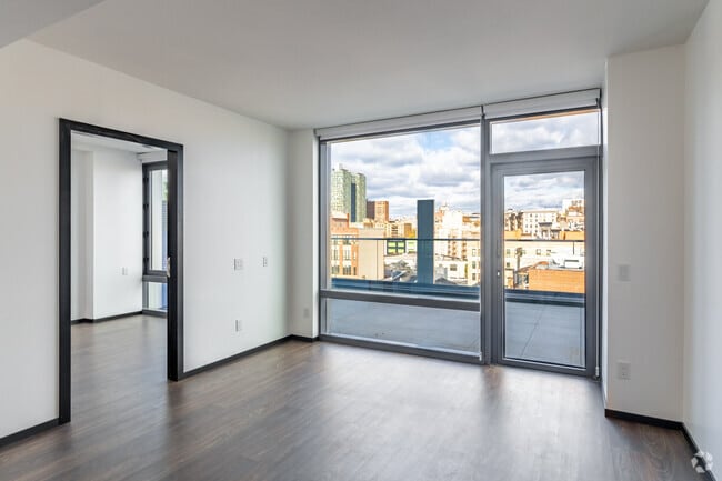 2 habitaciones, 2 baños - 748 pies cuadrados - Sala de estar - Forten at Columbia