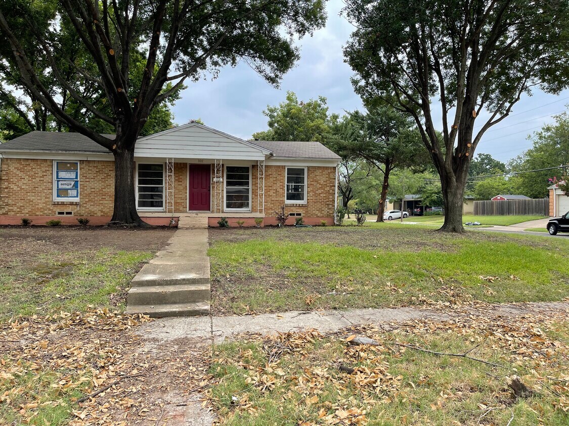 Front of house with new landscaping coming in. - 102 E Ireland Dr
