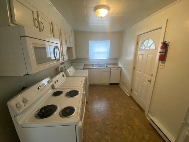 Building Photo - Private carport, in-unit laundry, and the Lakewood strip right outside your door.