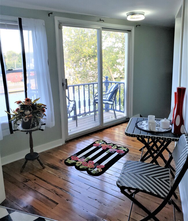 Hall coming into property with mini table for early morning coffee with a view - 20 Roselawn Ave