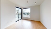 Located at 3675 Keystone Avenue in Los Angeles, this single-floor unit showcases a clean, contemporary design throughout. Light wood-tone flooring runs continuously across the space, creating a warm and cohesive aesthetic that complements the crisp white walls.

The open living area is generously proportioned, featuring recessed lighting and ample room for flexible furniture arrangements. It flows naturally toward the kitchen, which is outfitted with dark charcoal cabinetry — both upper and lower — paired with a matching dark countertop and backsplash. A stainless steel gas range and undermount sink complete the functional, modern kitchen design.

The sleeping area benefits from abundant natural light, delivered through large black-framed sliding glass doors and floor-to-ceiling windows that open to a private balcony. From here, elevated views stretch across the surrounding Palms neighborhood, with palm trees visible against the Los Angeles skyline — a quintessentially Southern California perspective.

A ceiling fan adds comfort to the bedroom, which also connects to a well-organized walk-in closet featuring built-in wood shelving and drawer units. The bathroom is finished with clean, modern fixtures and continues the light wood flooring, maintaining a consistent style throughout the unit.